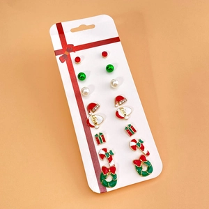 Detailed set of festive Christmas stud earrings featuring Santa and holiday motifs