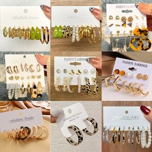 6-pair set of vintage C-shaped gold-tone earrings with leopard print and heart designs