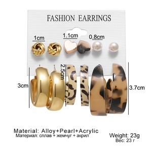 Detailed view of 6-pair vintage C-shape earring set with leopard and heart motifs