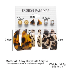 Detail of 6-pair vintage C-shape earrings set featuring leopard print and crystal studs