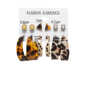 Set of 6 vintage C-shaped gold and leopard print resin hoop earrings on card