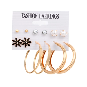 Detailed close-up of 6-piece fashion earring set featuring hoops and pearls