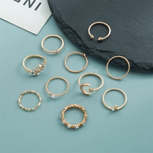 10-piece gold stacking ring set featuring crescent moon, star, pearls and crystal accents