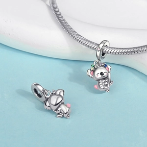 Detail of S925 sterling silver koala charm with colorful floral crown and green bamboo
