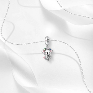 Macro shot of S925 sterling silver koala charm with pink enamel and floral crown details