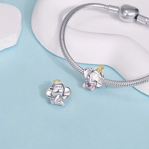 Detail view of silver elephant charms with gold crowns and S925 engraved on snake chain