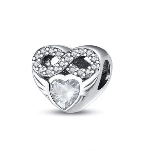 Macro detail of silver heart charm with infinity symbol and cubic zirconia stone