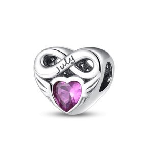 Detail of July birthstone charm with pink heart zircon and infinity symbol on silver base