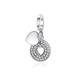 Close-up of S925 sterling silver heart charm with cubic zirconia pavé and hollow detail