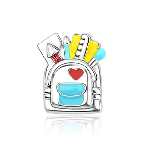 Detailed silver schoolbag charm with colorful enamel stationery and red heart detail