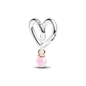 Detail of silver heart pendant with Mom engraving and pink opal bead for bracelets