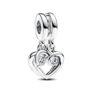Macro detail of double heart pendant charm with sparkling cubic zirconia stones