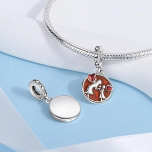 Detailed close-up of S925 silver charm featuring mother and daughter silhouette with red hearts