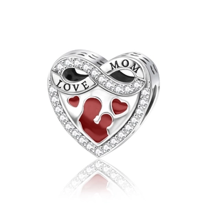 Macro detail of heart charm with infinity MOM engraving and red enamel for bracelets