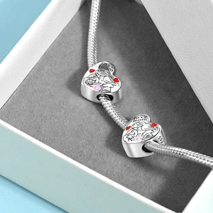 Detail of S925 silver heart charms with Mother and Child engraving and Love Mom text