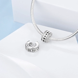 Detail of S925 silver charm with black stars and zircons showing the open clasp mechanism