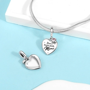 Silver heart pendant with 'Don't mess with Mama' engraving and pink gem on snake chain