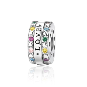 Detailed view of silver charm with LOVE engraving and colorful inlaid gemstones