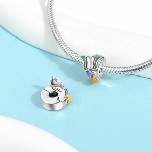 Detail of S925 silver clip charm with green enamel butterfly and star elements