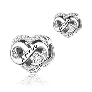 Detail of silver heart charm with April Strength engraving and sparkling stones