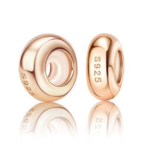 Macro shot of rose gold S925 sterling silver spacer beads with high-polish finish