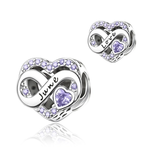 Detail of silver heart charm with purple zircon, featuring June and Love engraving