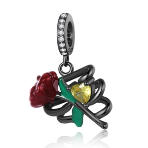 Detail of S925 sterling silver black gold rose pendant with red enamel and yellow heart crystal