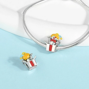 Macro detail of S925 sterling silver Jack-in-the-box charm with colorful enamel inlay