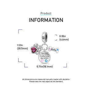 Macro detail of paw print pendant set with heart gem and engraved baby bone charm