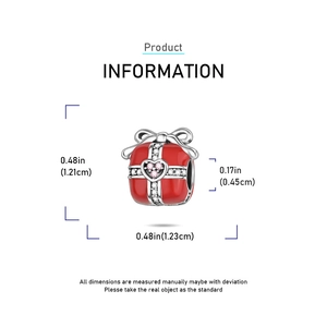 Detail of red enamel gift box charm with silver bow and heart-shaped zirconia stones