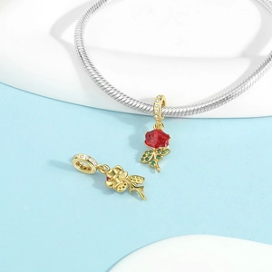 Macro detail of S925 sterling silver rose pendant with red enamel and zircon stones