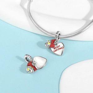 Detailed view of S925 silver heart charm with red bow and Merry Christmas text