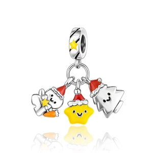 Detail of Christmas charms featuring gingerbread man and star with enamel on silver ring