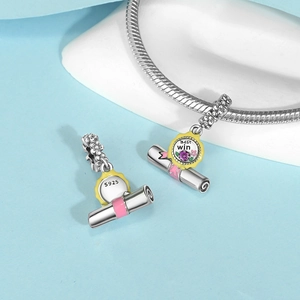 Macro detail of S925 sterling silver graduation charm with Best Win engraving and enamel