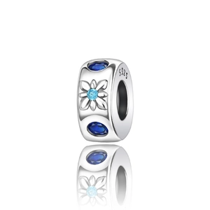 Macro detail of S925 silver charm bead featuring blue gemstones and floral relief