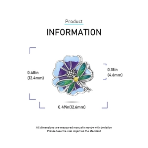 Detailed view of silver dragonfly and flower charm with purple enamel and zircon stone