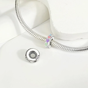 Detail of S925 sterling silver love charm with colorful enamel and side hallmark