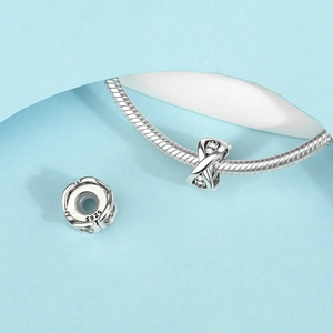 S925 sterling silver spacer charms with infinity design on a snake chain bracelet
