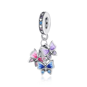 Detailed view of silver butterfly charms with colorful enamel and inlaid zircons