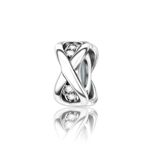 Macro shot of silver plated spacer bead with crisscross design and sparkling zircon stones