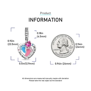 Detailed view of heart charm with baby footprints and size comparison to a coin