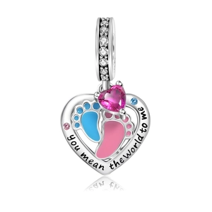 Detail of silver heart charm with baby footprints and 'you mean the world to me' engraving