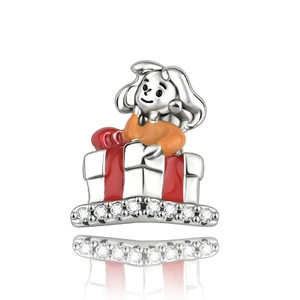 Detailed view of silver charm girl in gift box with red enamel and white zircon stones