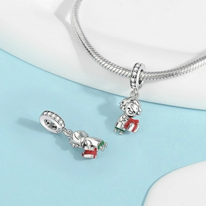 Macro shot of S925 silver boy pendant with red gift box and zircon stones on a snake chain