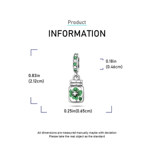Silver bottle charm with green four-leaf clover and pavé crystals on the bail
