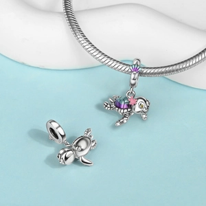 Macro shot of S925 silver sea turtle charm with blue and purple gradient enamel