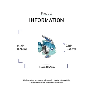 Macro view of 925 silver tropical fish charm with blue enamel and gemstone details