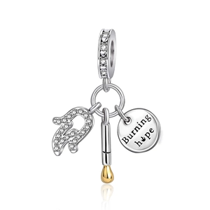 Silver Burning Hope charm featuring a matchstick and circular pendant with engraving