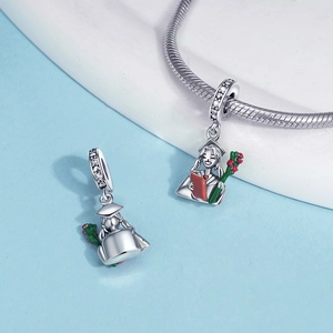 Macro view of S925 silver graduation charm featuring colorful enamel girl and certificate