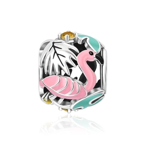 Macro shot of silver tropical flamingo charm with pink enamel and palm leaf details